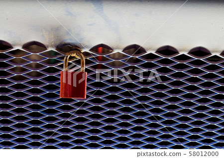 Red shiny padlock by night 58012000