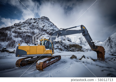 Old excavator in winter Old excavator in winter 58012713