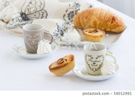 Cup of coffee with pasticciotto on a white 58012991