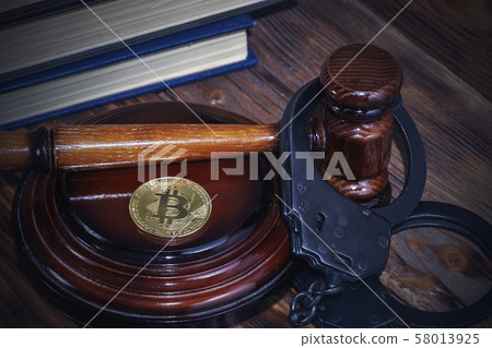 bitcoin, judge's hammer, handcuffs. Concept 58013925