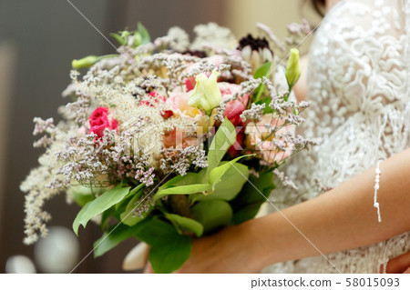 Caucasian romantic young bride celebrating his marriage in city 58015093