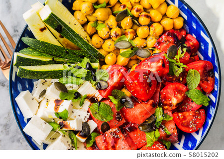 Chickpea watermelon salad with feta and tomatoes 58015202
