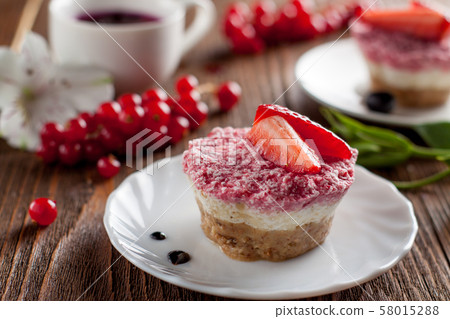 Raw vegan cheesecake with strawberry Raw vegan cheesecake with strawberry 58015288