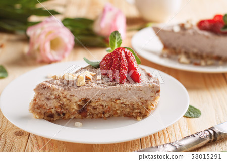 Raw vegan cheesecake with strawberry and banana Raw vegan cheesecake with strawberry and banana 58015291