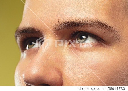 Caucasian young man's close up shot on yellow background Caucasian young man's close up shot on yellow background 58015780