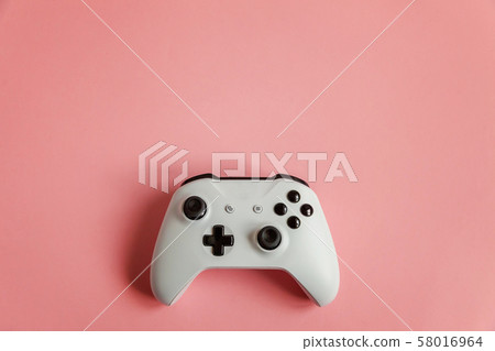 White joystick on pink background. Computer gaming White joystick on pink background. Computer gaming 58016964
