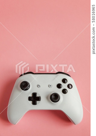 White joystick on pink background. Computer gaming White joystick on pink background. Computer gaming 58016965