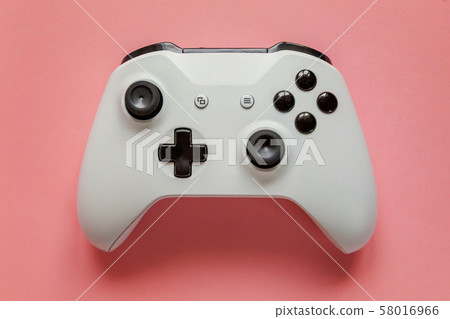 White joystick on pink background. Computer gaming White joystick on pink background. Computer gaming 58016966