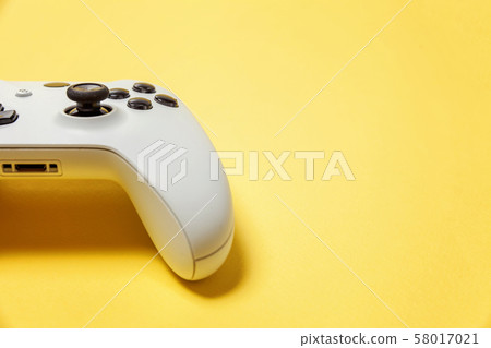White joystick on yellow background. Computer White joystick on yellow background. Computer 58017021
