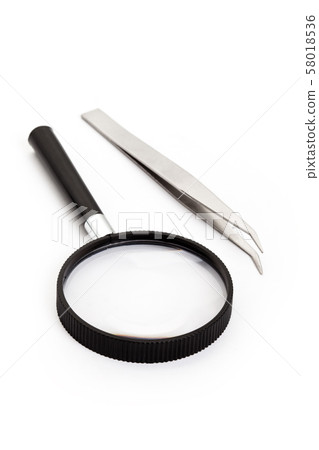 Tweezers and magnifying glass Tweezers and magnifying glass 58018536