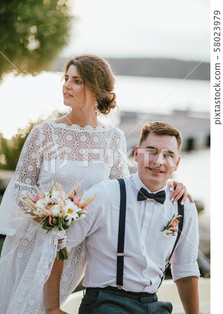 Happy newly married couple, smiling bride brunette Happy newly married couple, smiling bride brunette 58023979