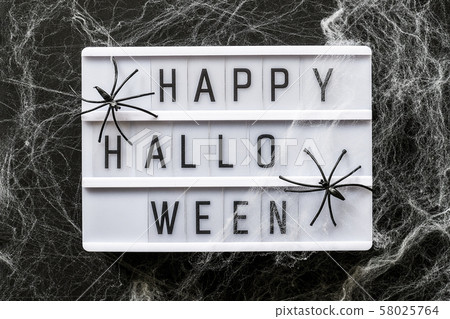 Lightbox with text Happy halloween decorated 58025764