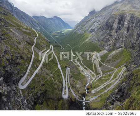 Trollstigen or Trolls Path Trollstigveien famous serpentine mountain road panorama from viewpoint in 58028663