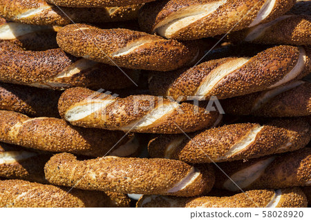Background with Turkish bagels simit, close-up 58028920