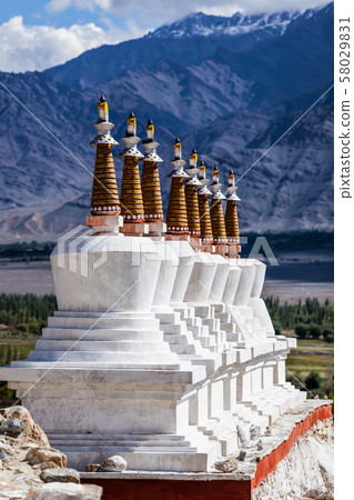 Buddhist chortens (stupas) in Himalayas. Buddhist chortens (stupas) in Himalayas. 58029831