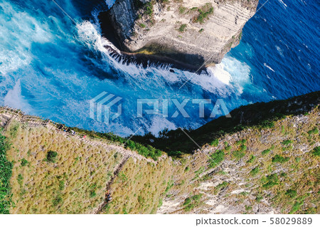 A way to go down to Kelingking beach, Nusa Penida, Bali. Royalty high quality stock image of landscape. 58029889