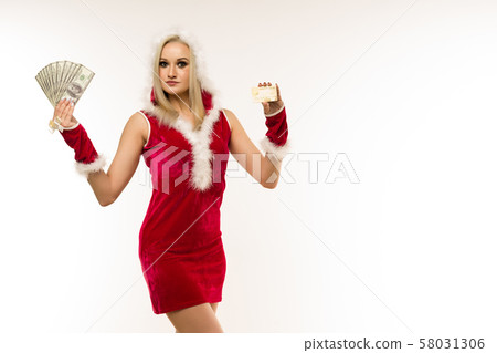 A beautiful sexy woman in a New Year's dress, hold A beautiful sexy woman in a New Year's dress, hold 58031306