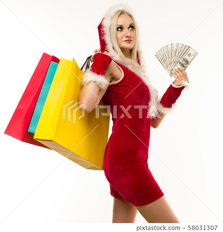 A beautiful sexy girl in a New Year's dress, hold 58031307