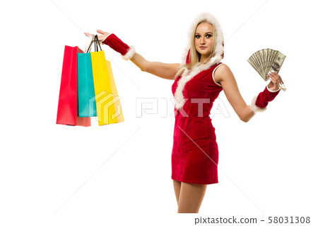 A beautiful sexy woman in a New Year's dress, hold 58031308