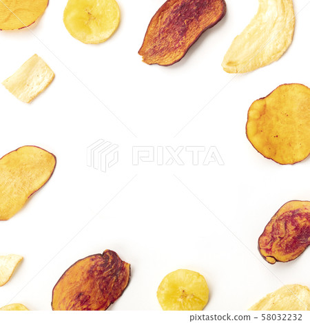 Dry fruit and vegetable chips on a white background, forming a frame for copy space, overhead square 58032232
