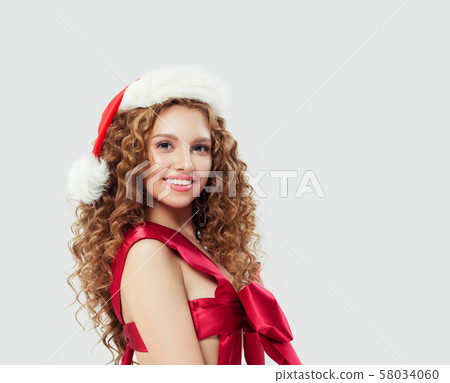 Sexy woman in red silky swimsuit and Santa hat Sexy woman in red silky swimsuit and Santa hat 58034060