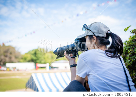 A woman taking an athletic meeting 58034513