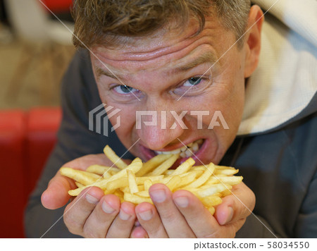 Fast food eating 58034550