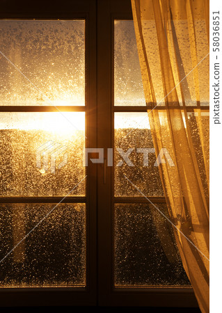 raindrops on window pane 58036851