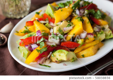 Healthy vegetable salad with mango, avocado Healthy vegetable salad with mango, avocado 58038656