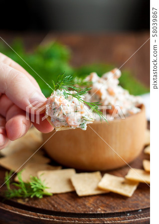 Smoked salmon and cream cheese dip with crackers 58039867