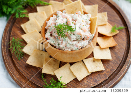 Smoked salmon and cream cheese dip with crackers 58039869