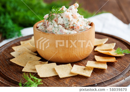 Smoked salmon and cream cheese dip with crackers Smoked salmon and cream cheese dip with crackers 58039870