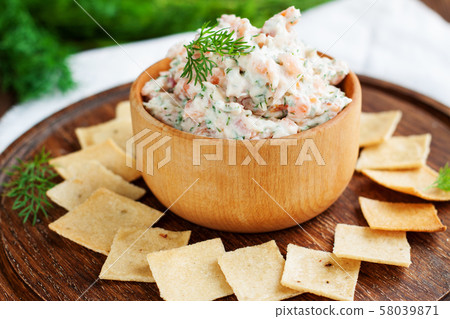 Smoked salmon and cream cheese dip with crackers Smoked salmon and cream cheese dip with crackers 58039871