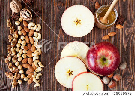 Sliced red apples, honey, nuts Sliced red apples, honey, nuts 58039872