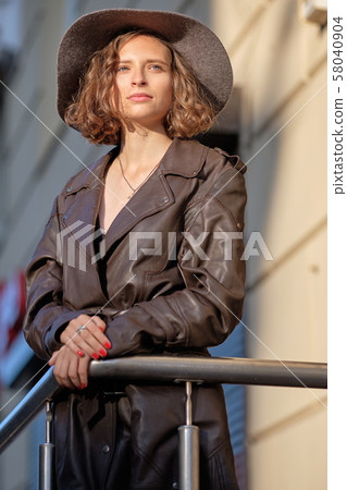 Beautiful lady in long vintage coat ant hat Beautiful lady in long vintage coat ant hat 58040904