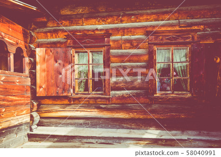 Traditional Siberian wooden house in the Taltsy Architectural-Ethnographic Museum. 58040991