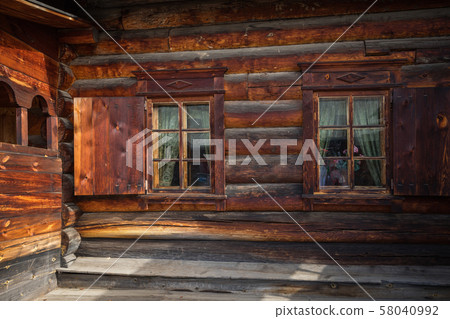 Traditional Siberian wooden house in the Taltsy Architectural-Ethnographic Museum. 58040992