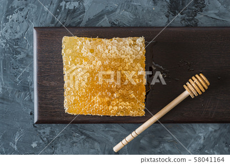 Honeycomb on brown plate Honeycomb on brown plate 58041164