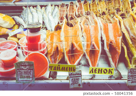 Dried fish Omul lying on the counter in Listvyanka, Lake Baikal. Siberia. Russia. Dried fish Omul lying on the counter in Listvyanka, Lake Baikal. Siberia. Russia. 58041356