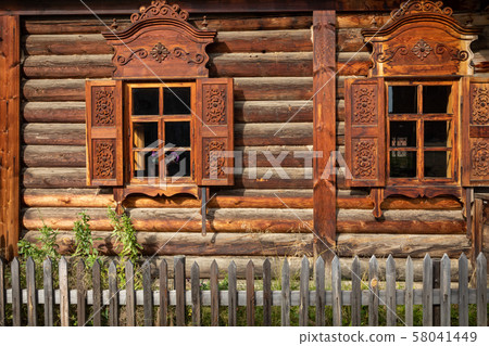 Traditional Siberian wooden house in the Taltsy Architectural-Ethnographic Museum. 58041449