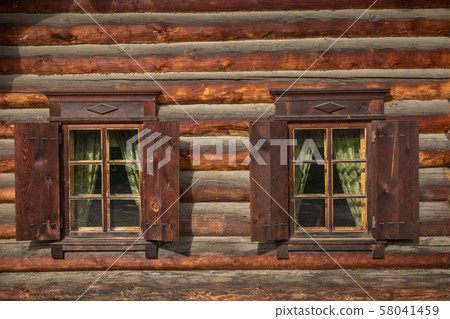 Traditional Siberian wooden house in the Taltsy Architectural-Ethnographic Museum. Traditional Siberian wooden house in the Taltsy Architectural-Ethnographic Museum. 58041459