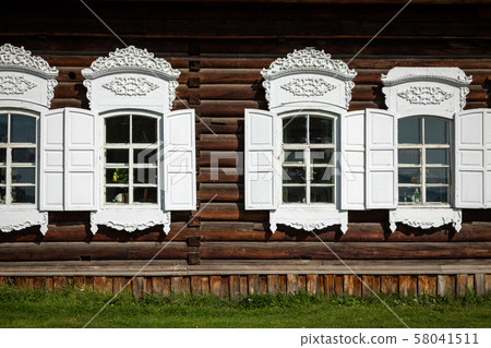 Traditional Siberian wooden house in the Taltsy Architectural-Ethnographic Museum. 58041511