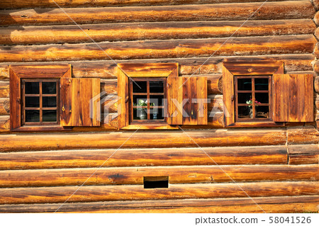 Traditional Siberian wooden house in the Taltsy Architectural-Ethnographic Museum. Traditional Siberian wooden house in the Taltsy Architectural-Ethnographic Museum. 58041526