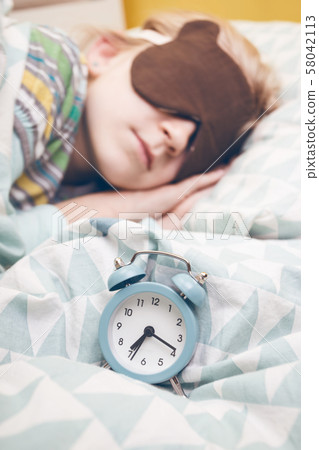 little girl sleeping in sleep mask little girl sleeping in sleep mask 58042113