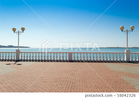 View on seascape from promenade in sunny day. Vacation concept background. Sea bay in Gelendzhik 58042326