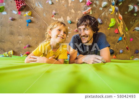 Dad and son at the climbing wall. Family sport, healthy lifestyle, happy family 58042493