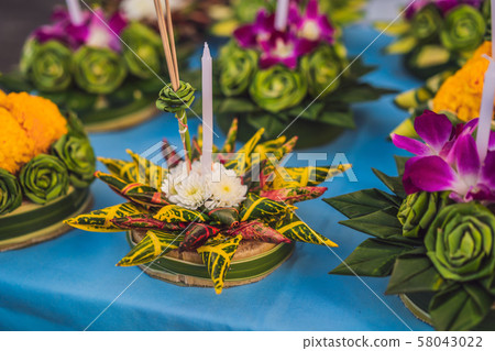 Loy Krathong festival, People buy flowers and candle to light and float on water to celebrate the Loy Krathong festival, People buy flowers and candle to light and float on water to celebrate the 58043022