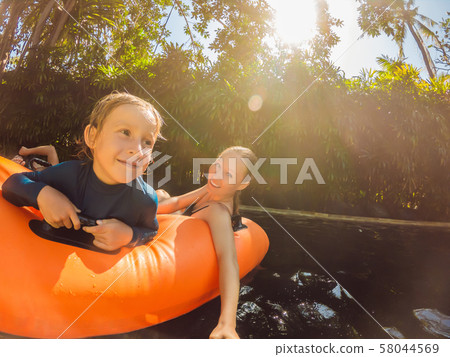 Mom and son have fun at the water park 58044569