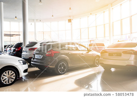 New cars at sunlit dealer showroom close view 58053478