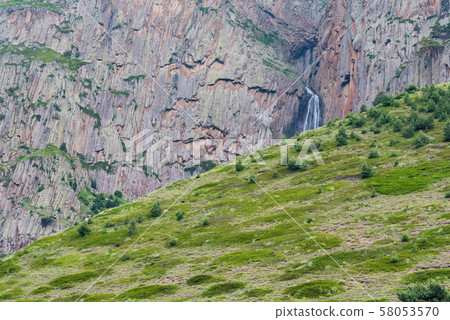 Summer landscape with mountain waterfall between two rocks Summer landscape with mountain waterfall between two rocks 58053570